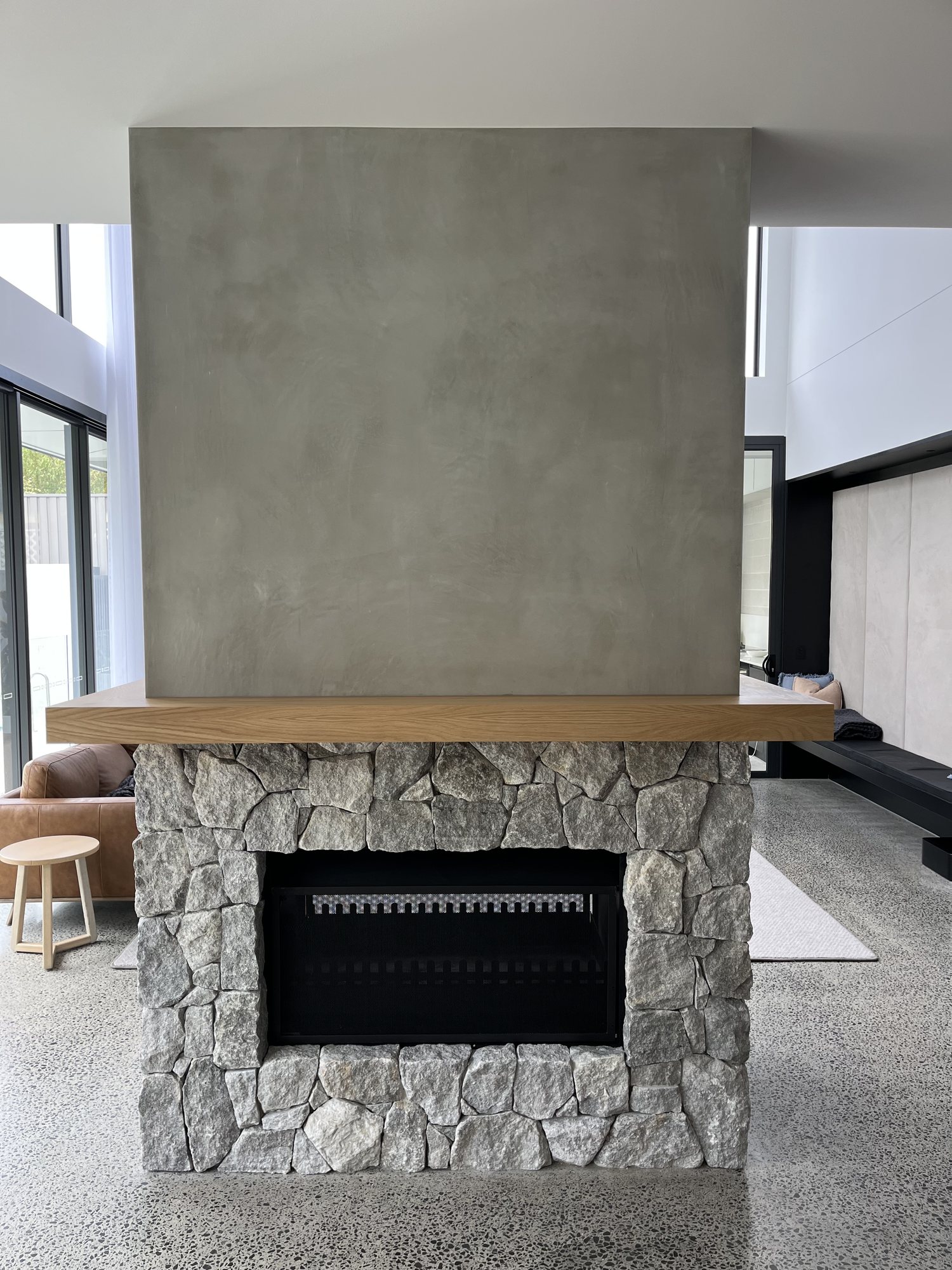Grey natural stone fireplace cladding with timber mantel – Stone Cladding Sunshine Coast Grey natural stone fireplace cladding with timber mantel - Stone Cladding Sunshine Coast
