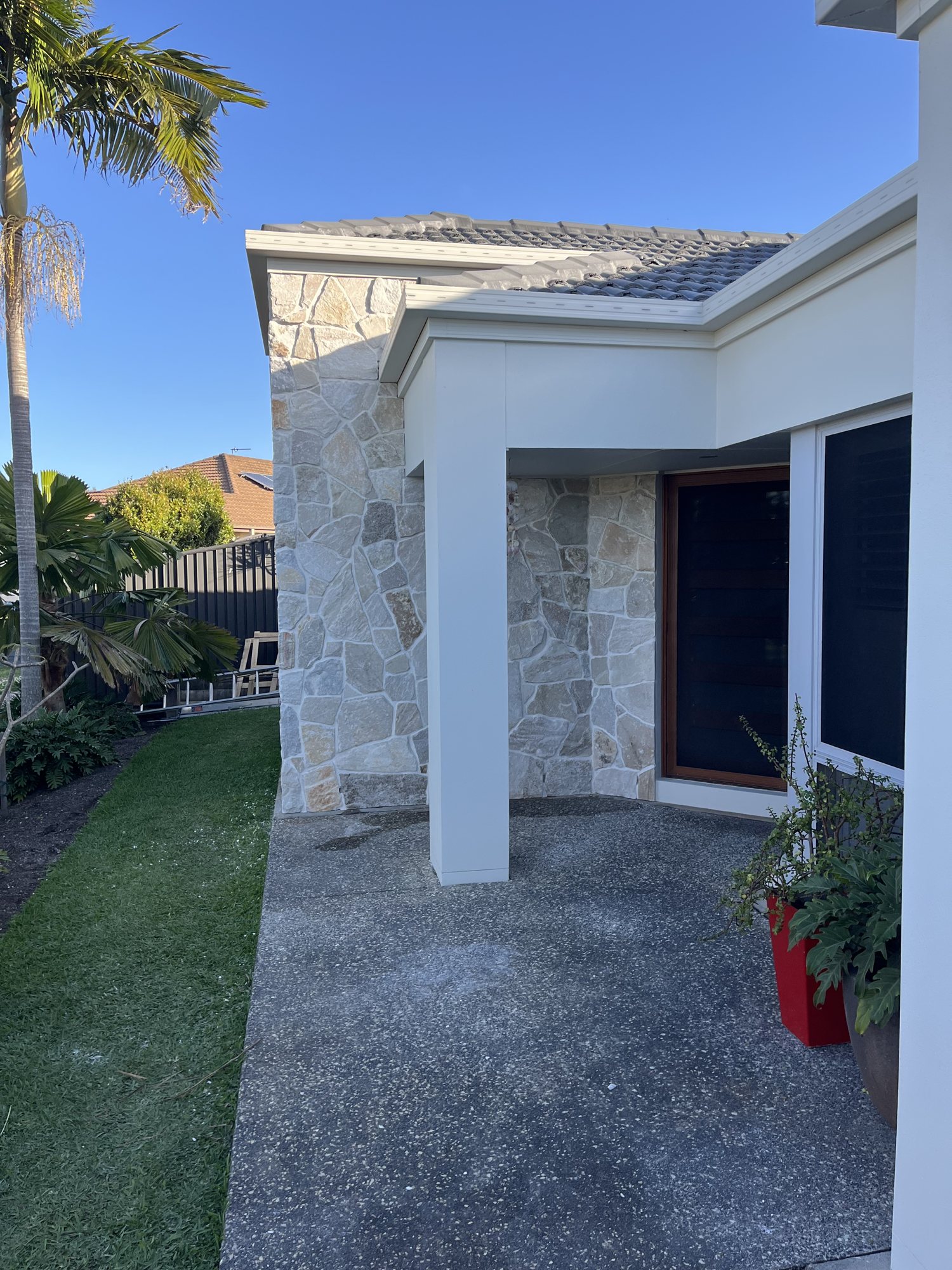 Little Mountain front entry after natural stone cladding
