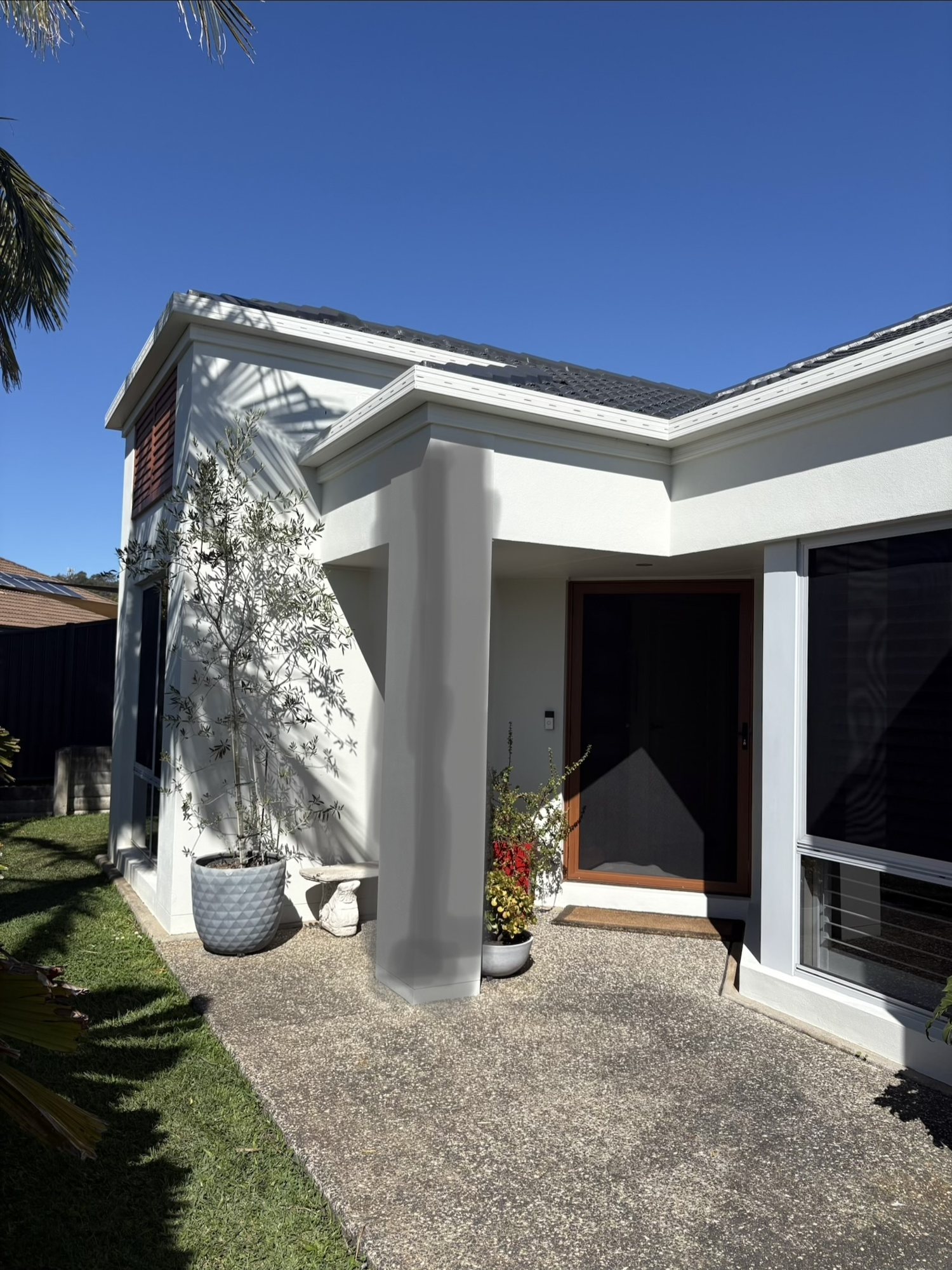 Little Mountain front entry before stone cladding – plain white render