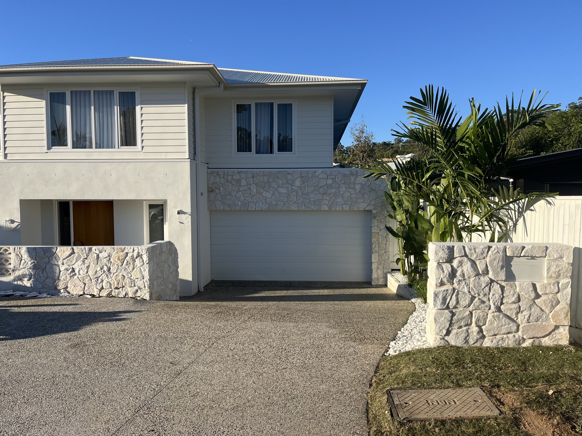 stone-clad-letterbox-pier-facade-sunshine-coast Stone clad letterbox pier and garage facade - Sunshine Coast
