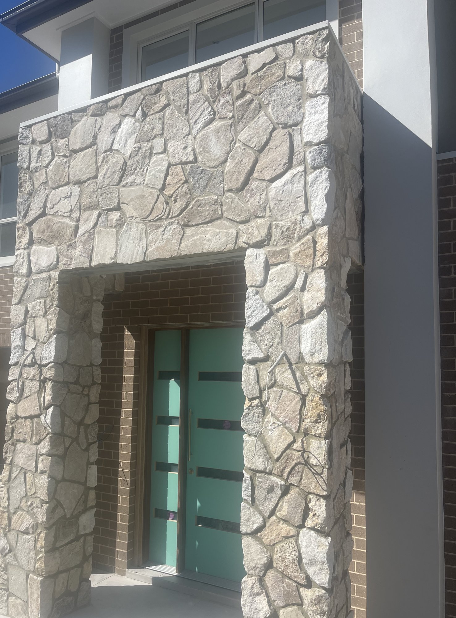 Natural stone clad entry portico pillars - Stone Cladding Pillars Sunshine Coast