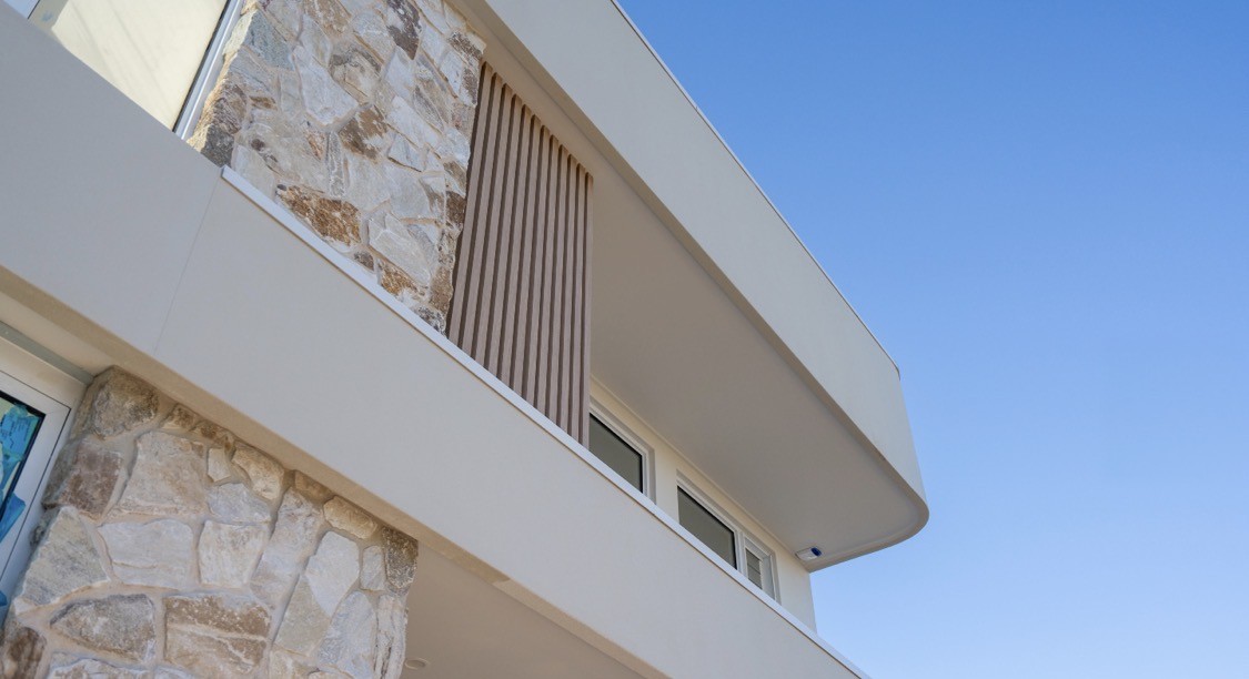 Natural stone cladding facade on a modern two-storey home - Stone Cladding Facades Sunshine Coast