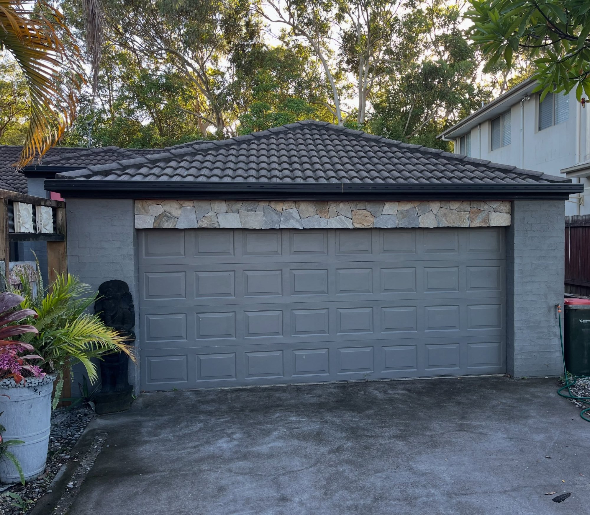 Blue steel random stone cladding over a garage door - Peregian Springs, Sunshine Coast