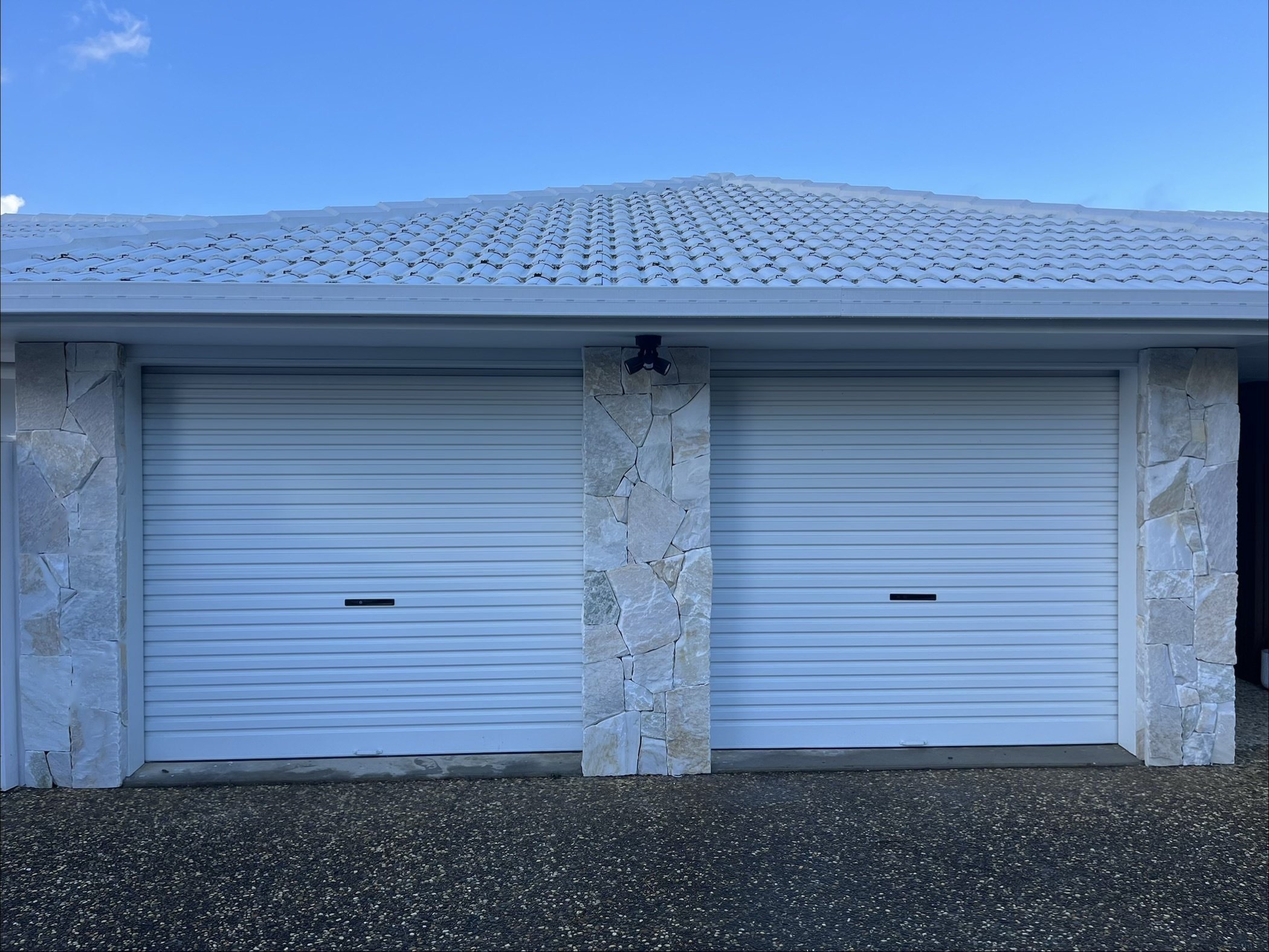 Natural stone cladding on double garage pillars - Sunshine Coast