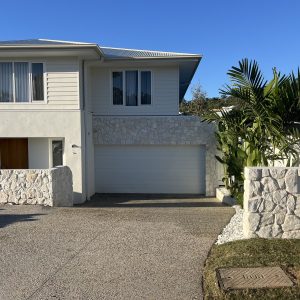 Stone clad letterbox pier and garage facade - Sunshine Coast