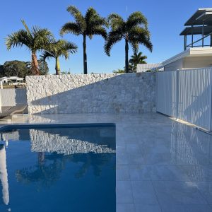 Natural stone clad pool wall - Stone Cladding Sunshine Coast